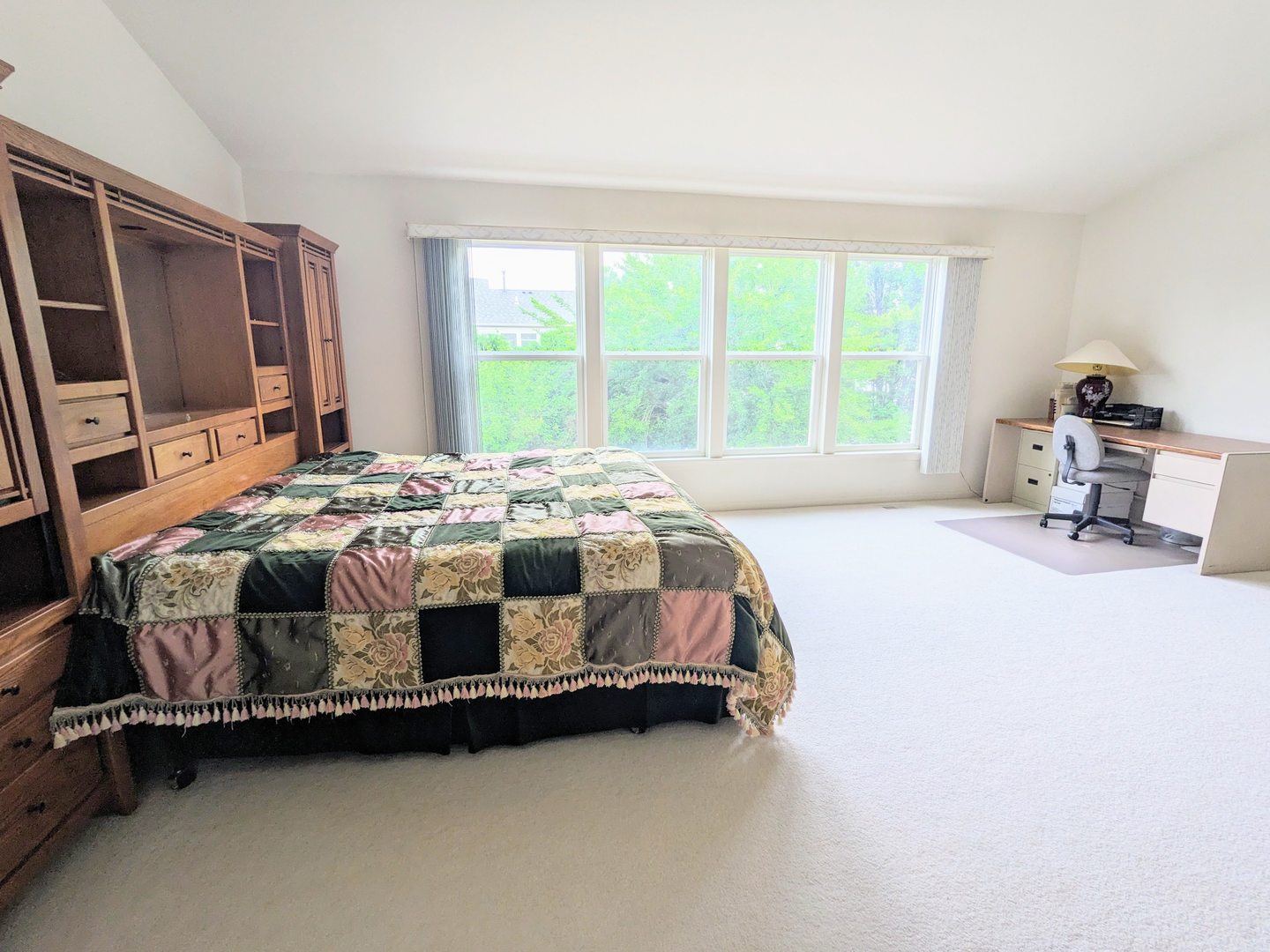 24632 Apollo Drive Plainfield, IL 60585 - Photo 8 of 22 a bedroom with a bed chair and a window