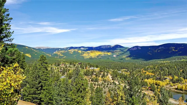 a view of a city with mountains in the background