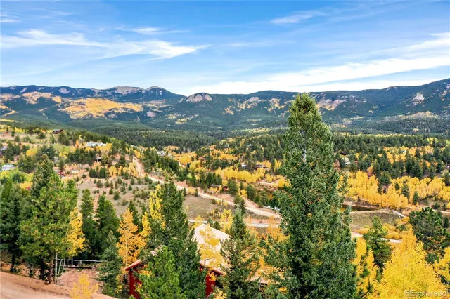 a view of mountain with lake view
