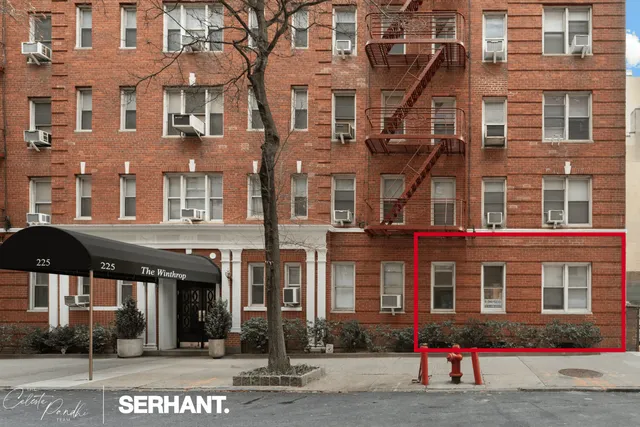 a group of cars parked in front of building
