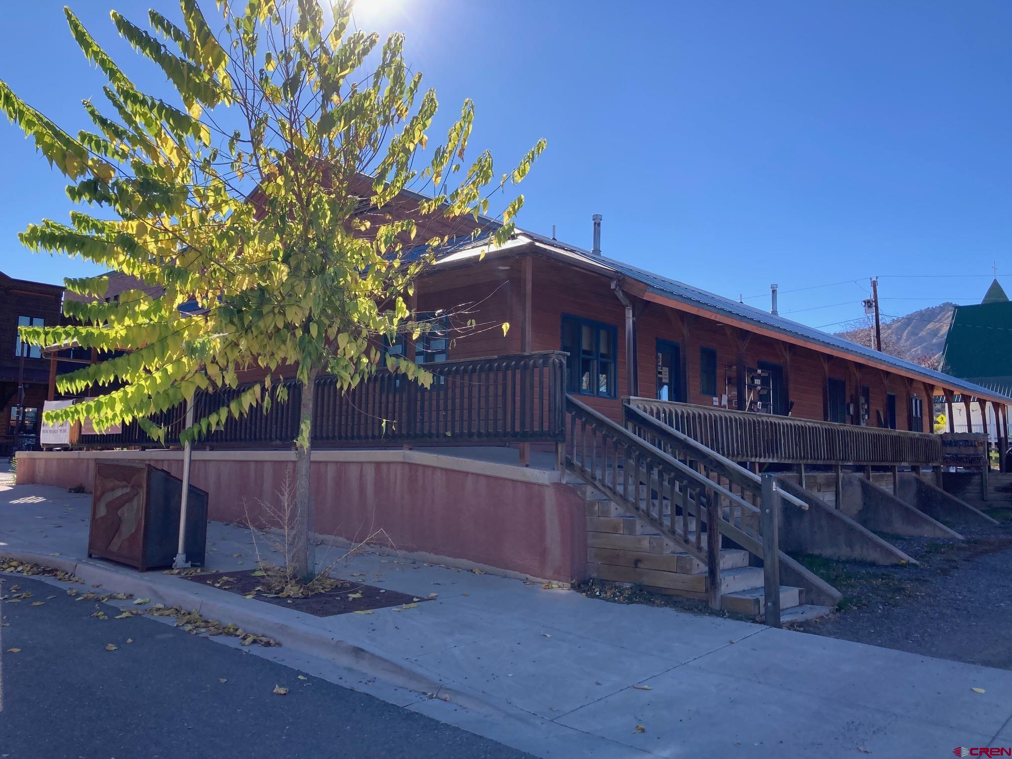 631 Sherman Street Ridgway, CO 81432 - Photo 7 of 11 a view of a house with backyard and sitting area