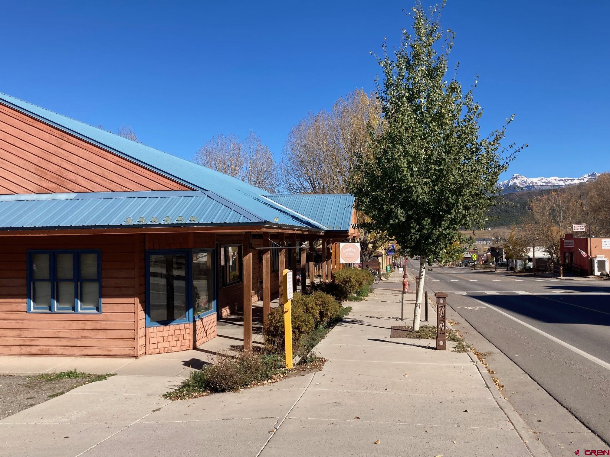 631 Sherman Street Ridgway, CO 81432 - Photo 10 of 11 a view of a building with traffic signal
