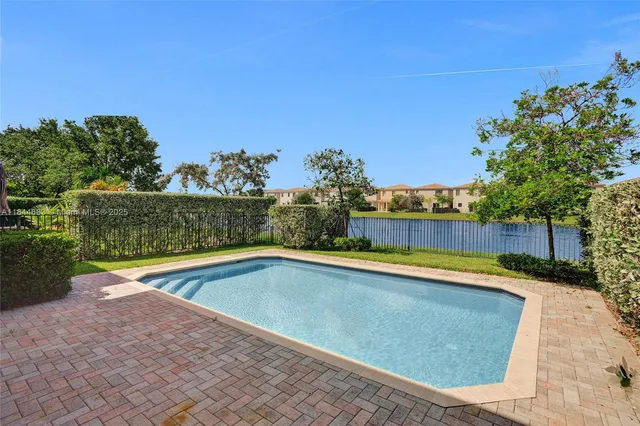 a view of a swimming pool and an outdoor space