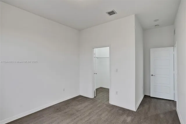 a view of a lake with houses in the back