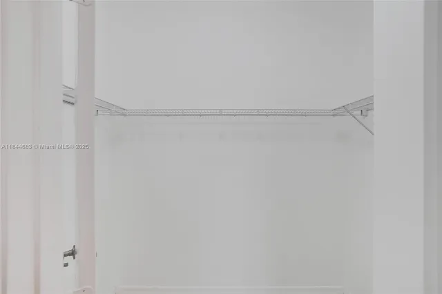 a view of a lake with houses in the back