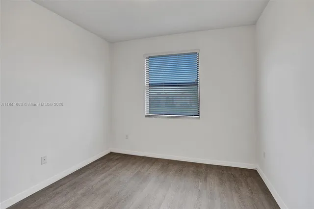 a view of a lake with houses in the back