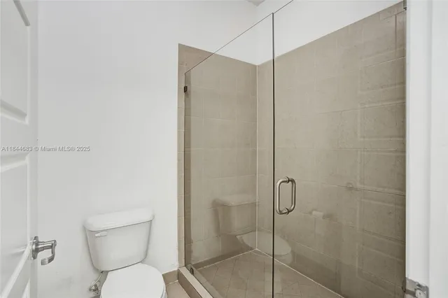 a aerial view of a house with a yard