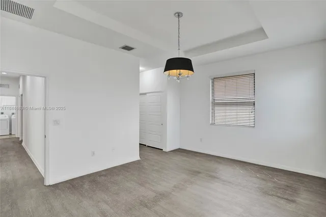 an aerial view of a house with a garden
