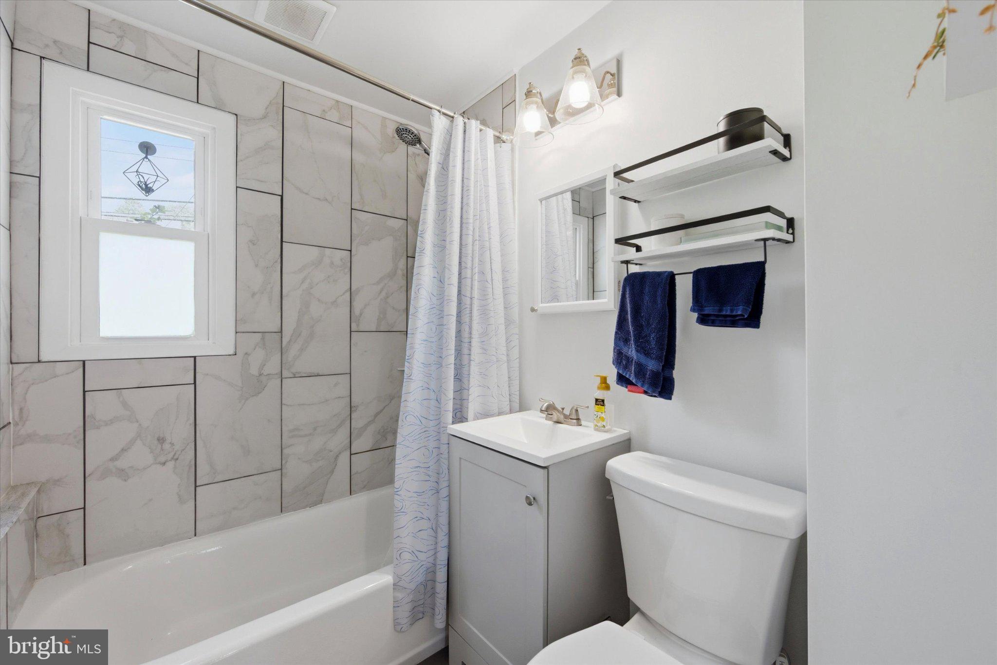 702 Hood Road Swarthmore, PA 19081 - Photo 21 of 35 Modern bathroom with elegant tiles.