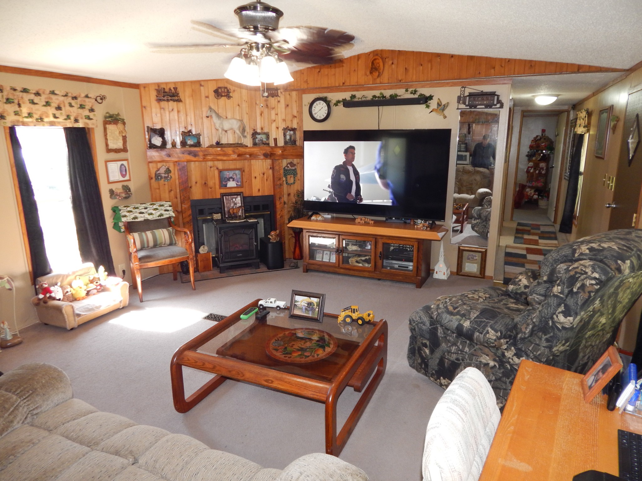 6223 Beech Creek Road Clifton, TN 38425 - Photo 12 of 68 a living room with furniture and a flat screen tv