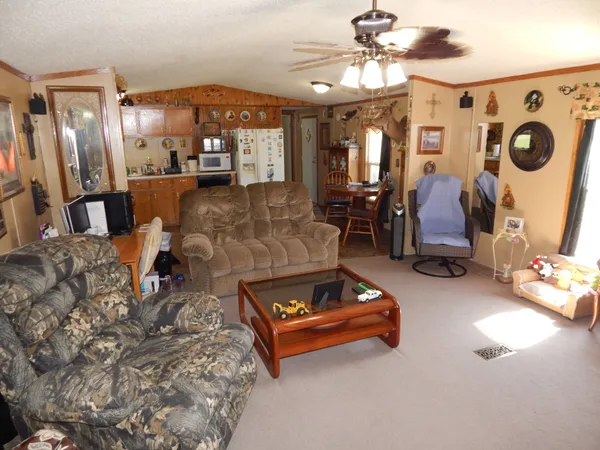 a kitchen with stainless steel appliances a stove a sink and a microwave