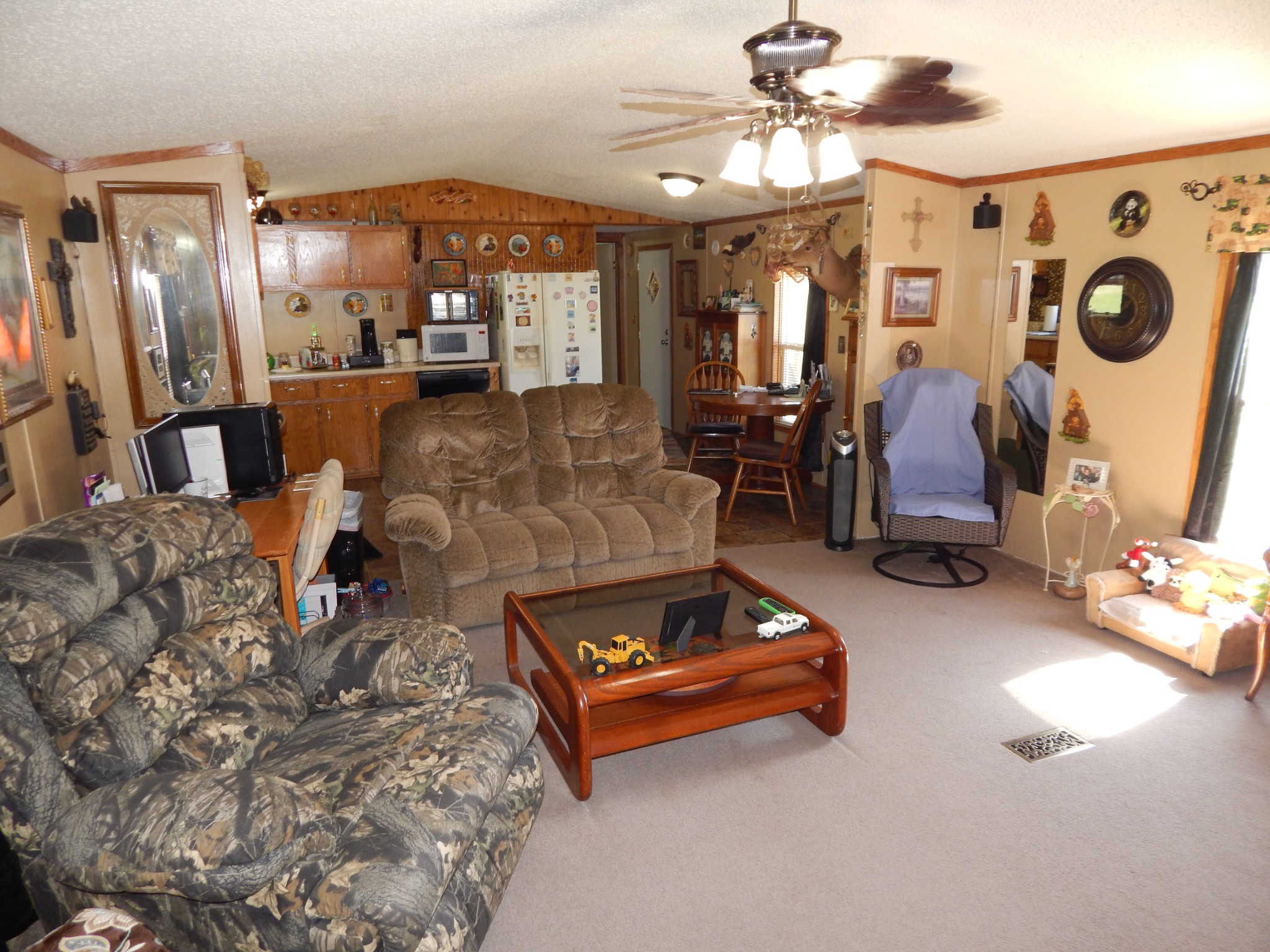 6223 Beech Creek Road Clifton, TN 38425 - Photo 13 of 68 a living room with patio furniture and a chandelier