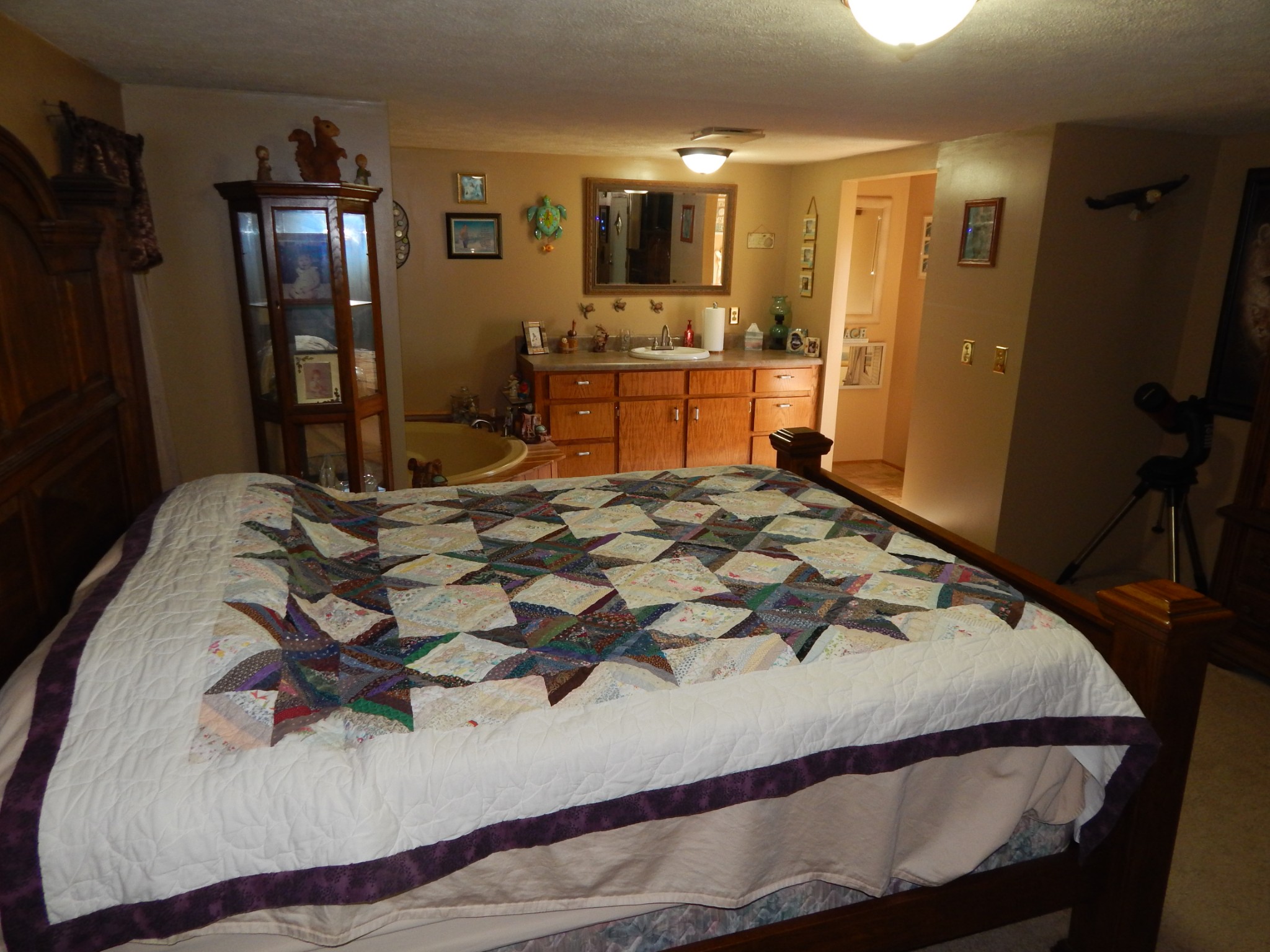 6223 Beech Creek Road Clifton, TN 38425 - Photo 19 of 68 a bedroom with a bed and dresser with mirror