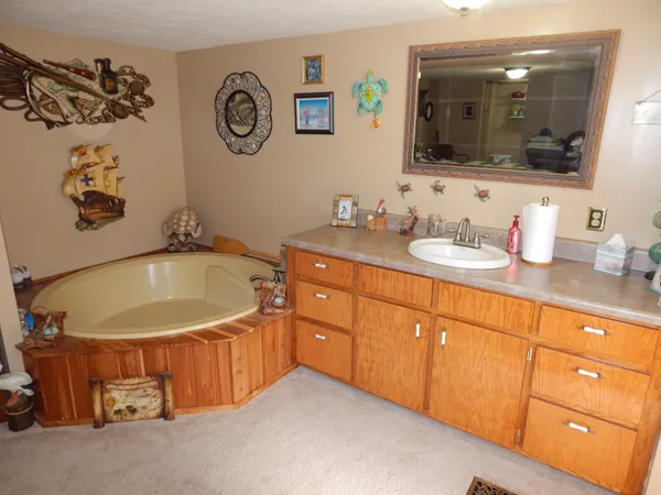 a bathroom with a toilet and a mirror