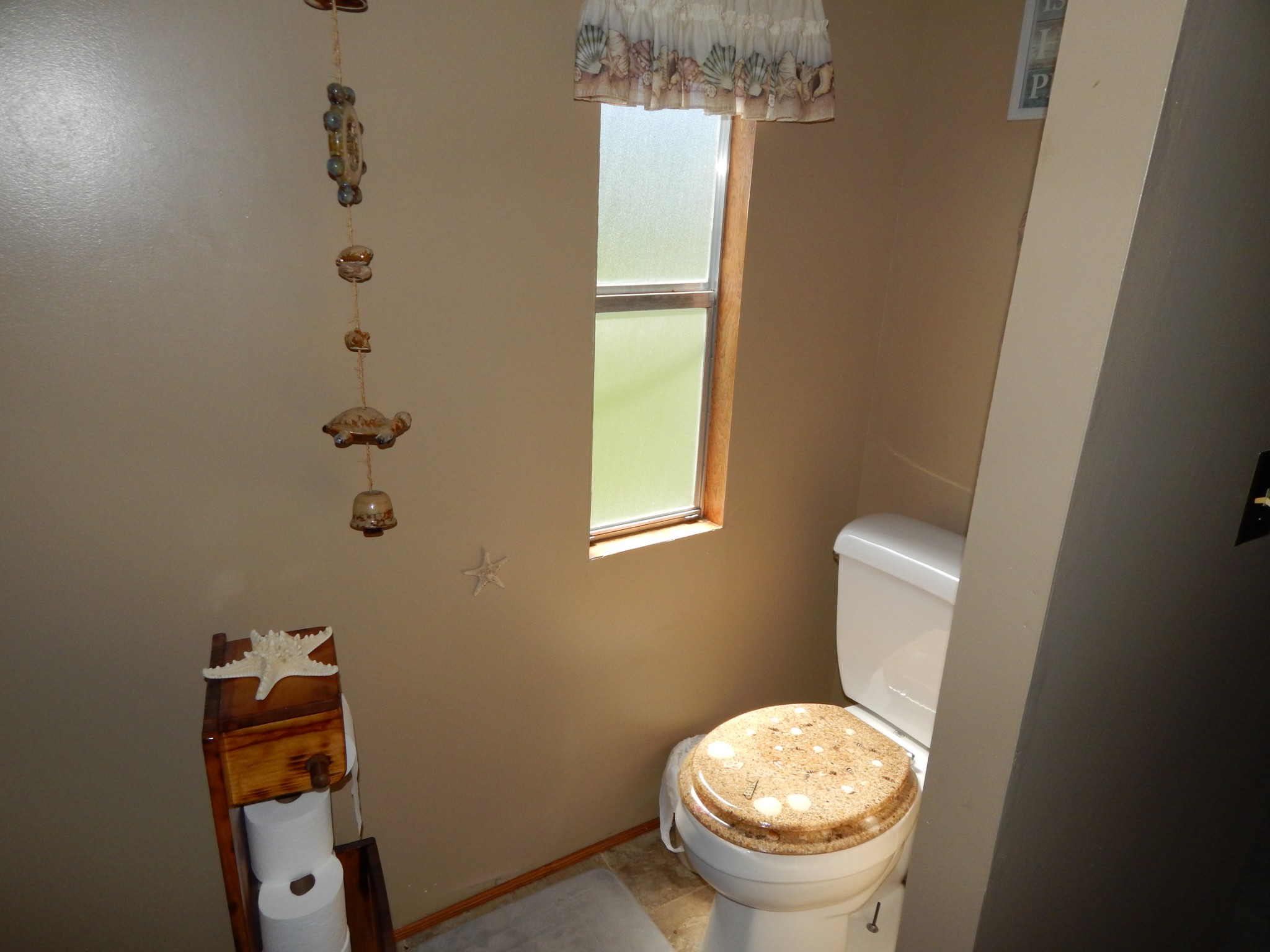 6223 Beech Creek Road Clifton, TN 38425 - Photo 21 of 68 a bathroom with a toilet and a sink
