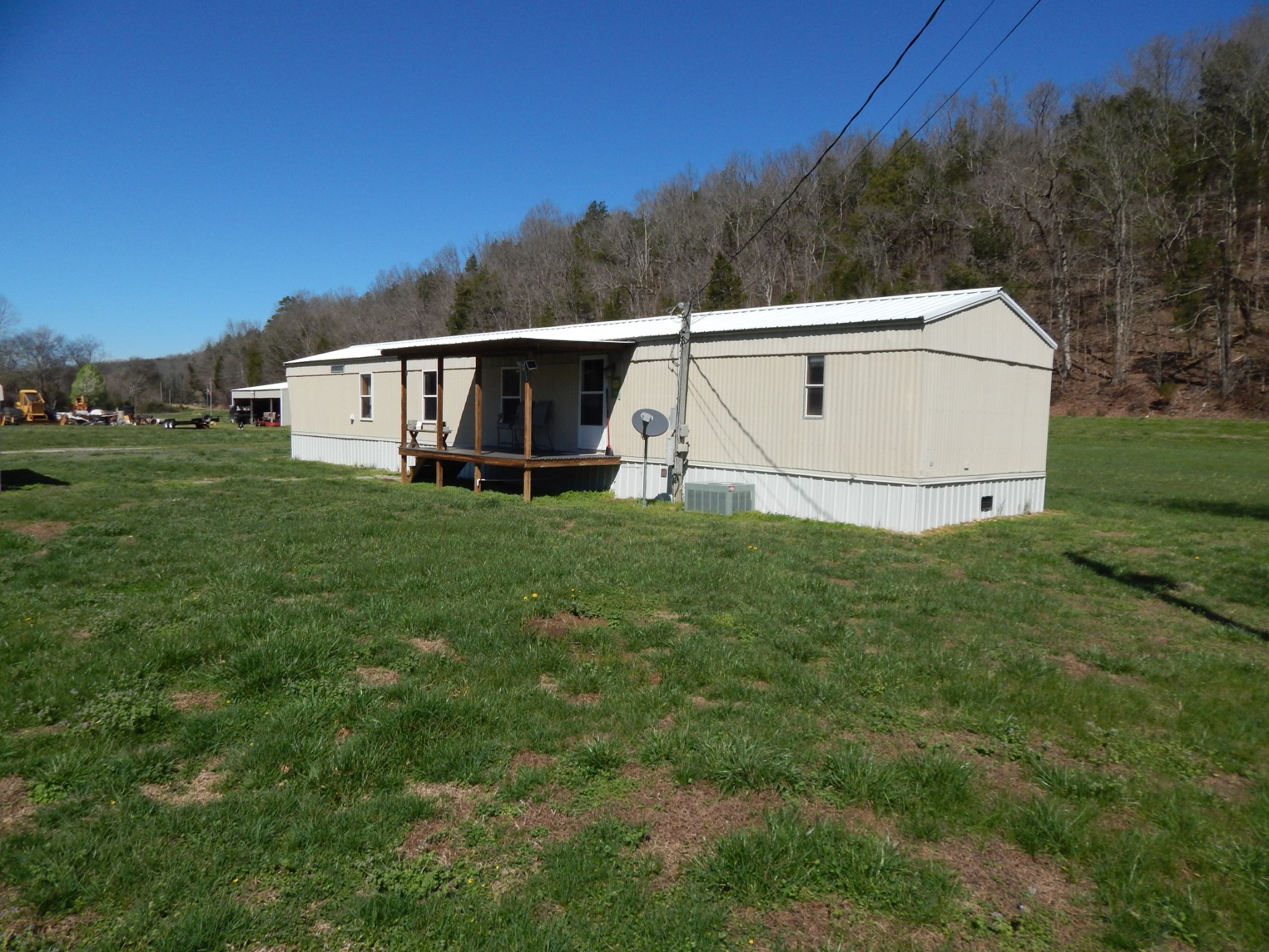 6223 Beech Creek Road Clifton, TN 38425 - Photo 8 of 68 a view of a white house with a big yard