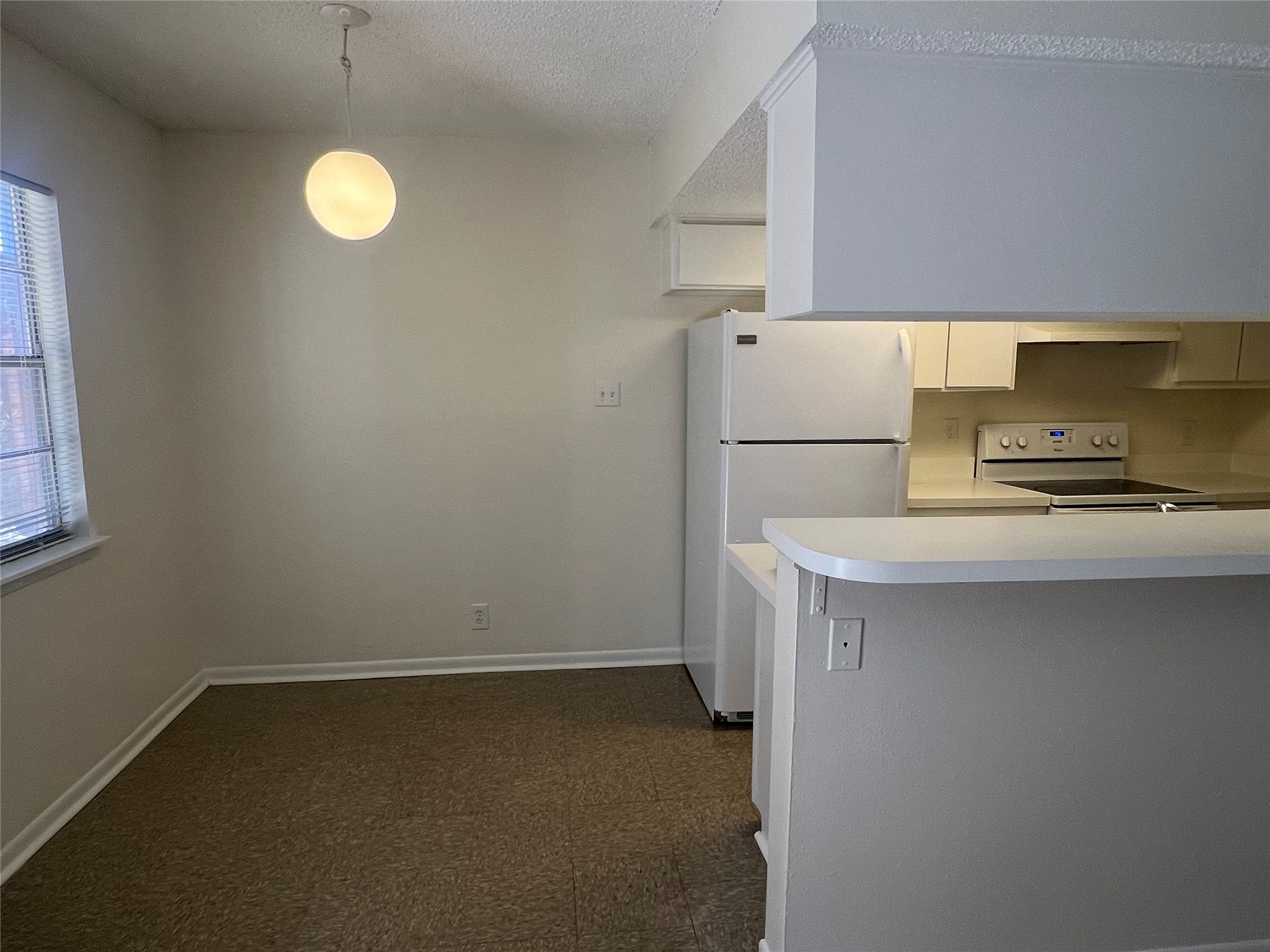 1410 West N Loop Boulevard, Unit 102 Austin, TX 78756 - Photo 15 of 24 a kitchen with a refrigerator and a stove