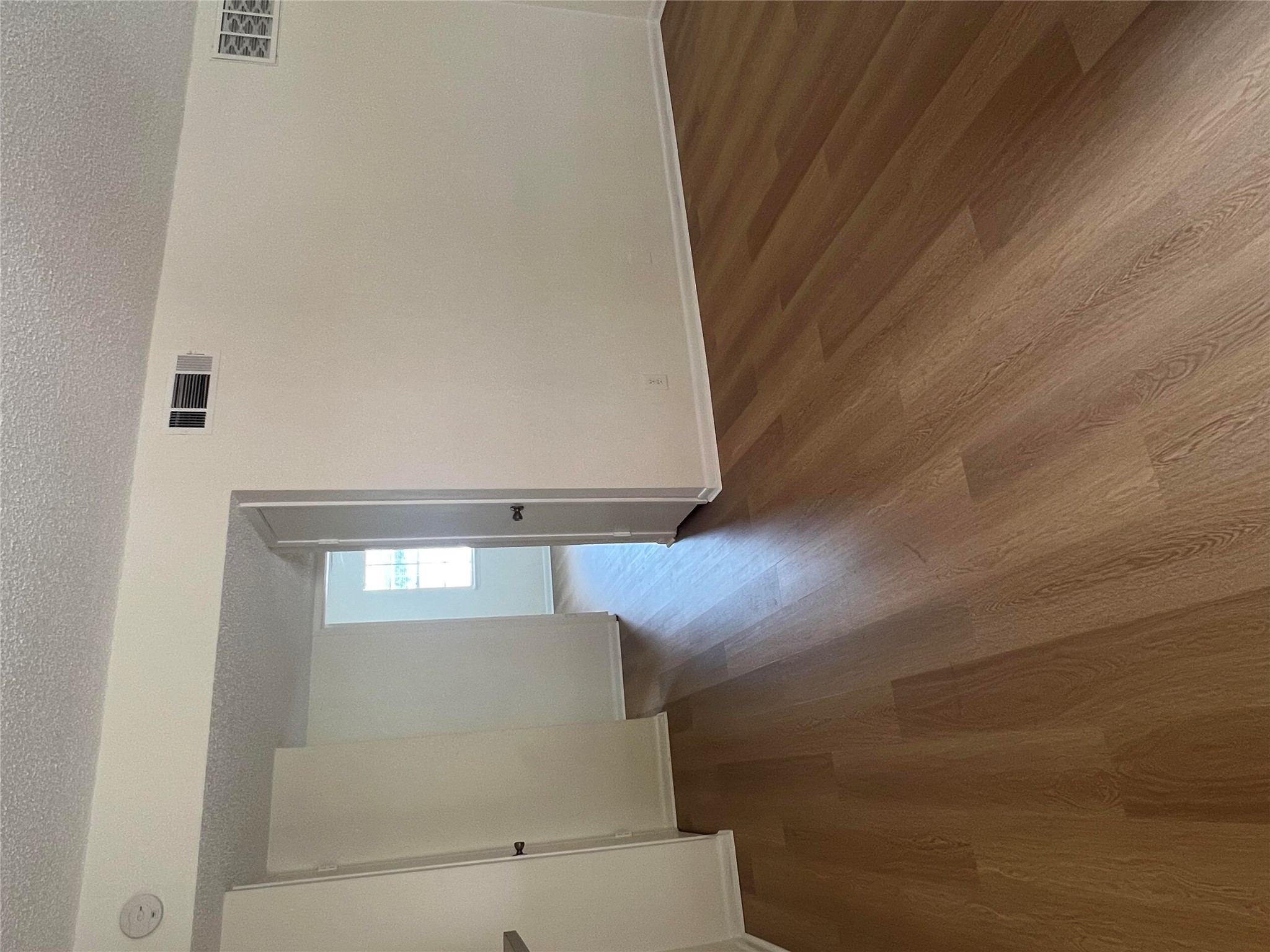 1410 West N Loop Boulevard, Unit 102 Austin, TX 78756 - Photo 19 of 24 wooden floor in a hall with an empty room