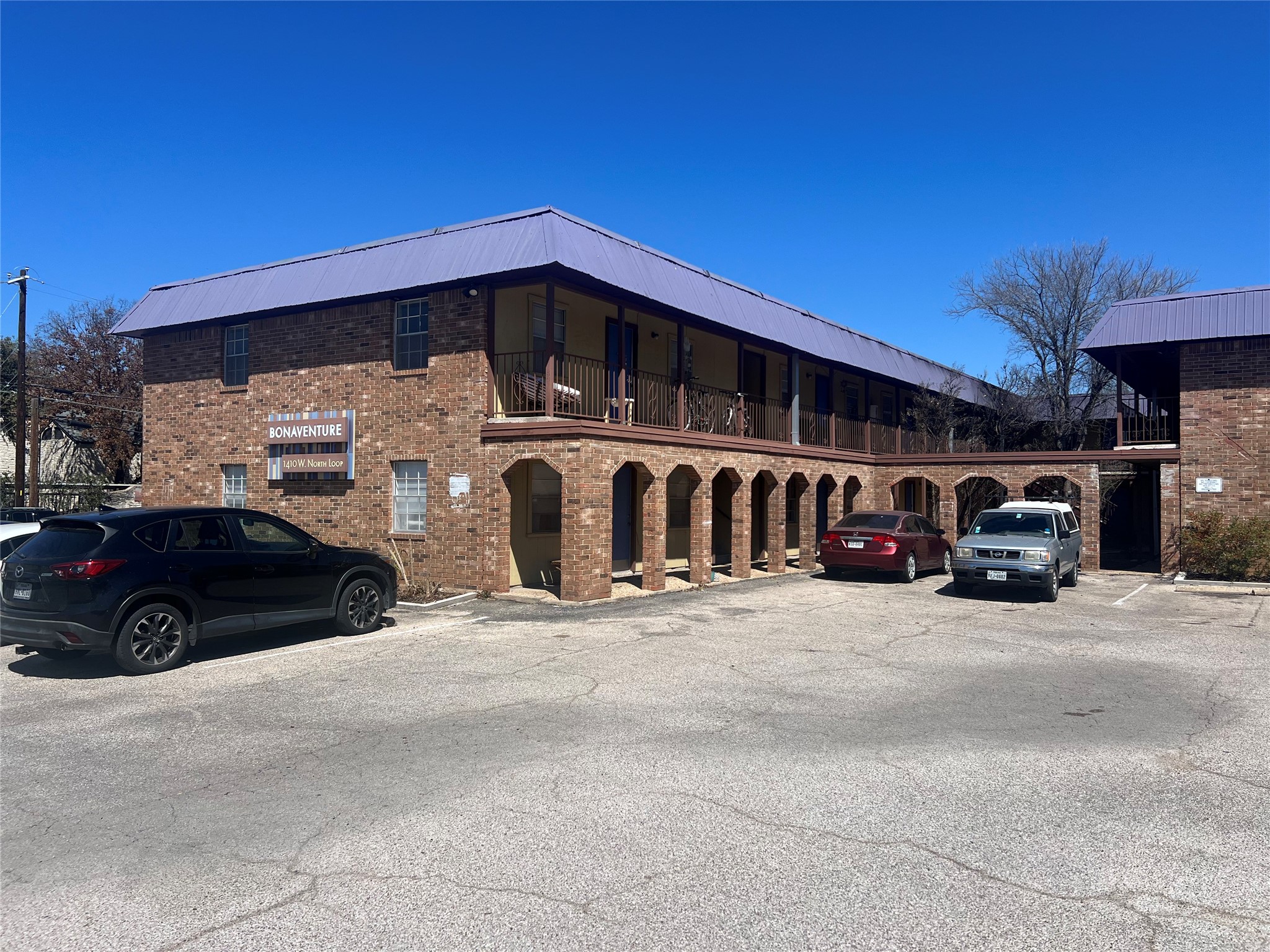 1410 West N Loop Boulevard, Unit 102 Austin, TX 78756 - Photo 2 of 24 a view of parking area