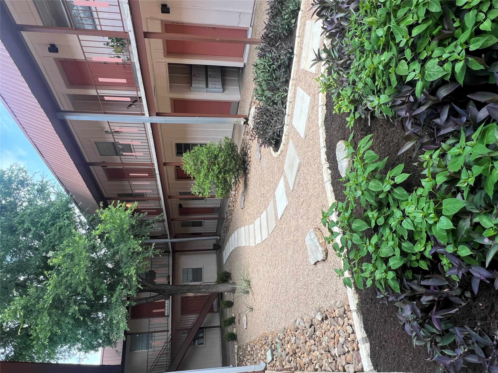 1410 West N Loop Boulevard, Unit 102 Austin, TX 78756 - Photo 5 of 24 a backyard of a house with lots of green space