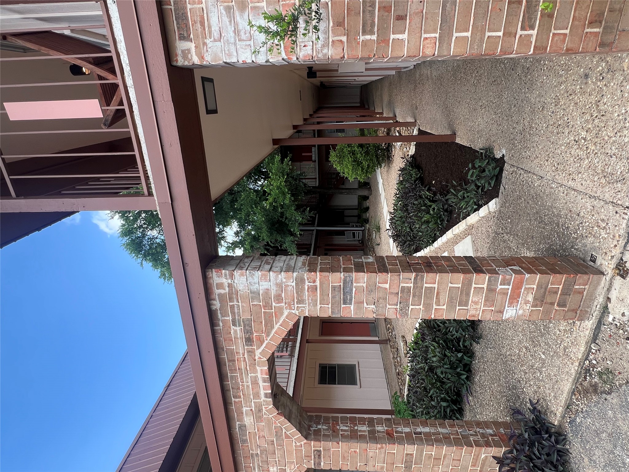 1410 West N Loop Boulevard, Unit 102 Austin, TX 78756 - Photo 8 of 24 a view of a house with a porch