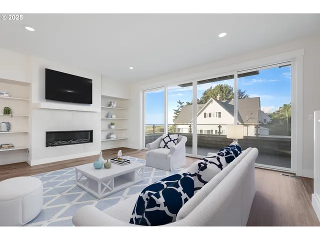 a living room with furniture a fireplace and a flat screen tv