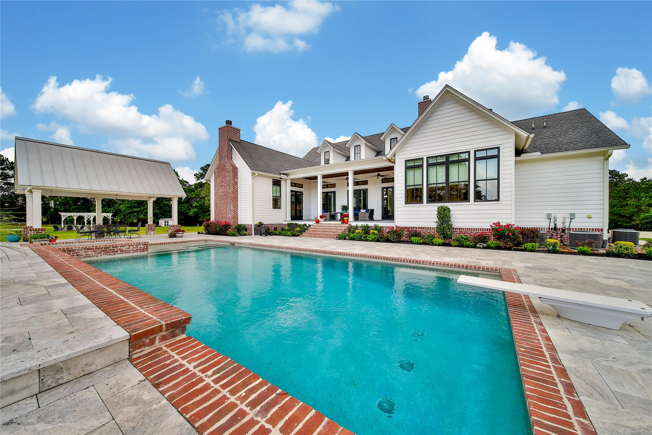 18875 Rabon Chapel Road Montgomery, TX 77316 - Photo 33 of 45 a view of an house with swimming pool and chairs