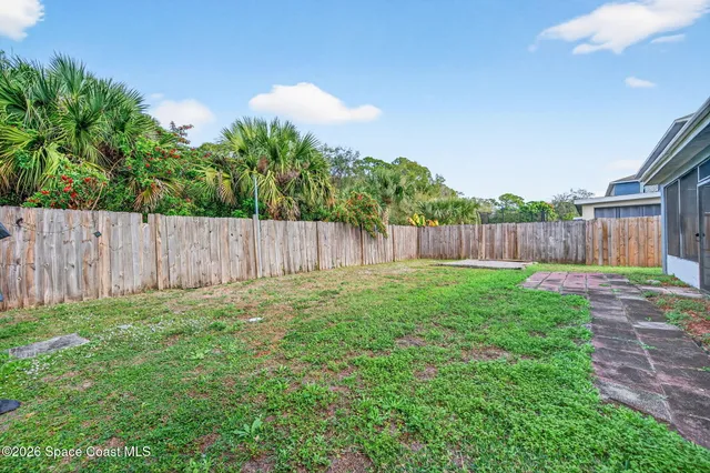 an aerial view of a house with yard swimming pool and outdoor seating