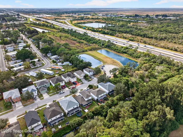 an aerial view of a house with garden