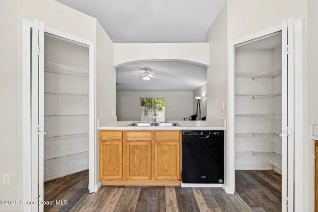 a large kitchen with stainless steel appliances kitchen island granite countertop a refrigerator and a stove top oven