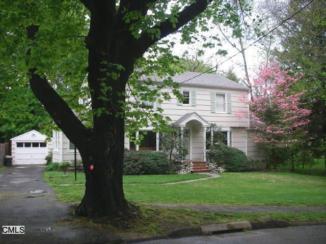 23 Turkey Hill Road North Westport, CT 06880 - Photo 1 of 1 a front view of a house with garden