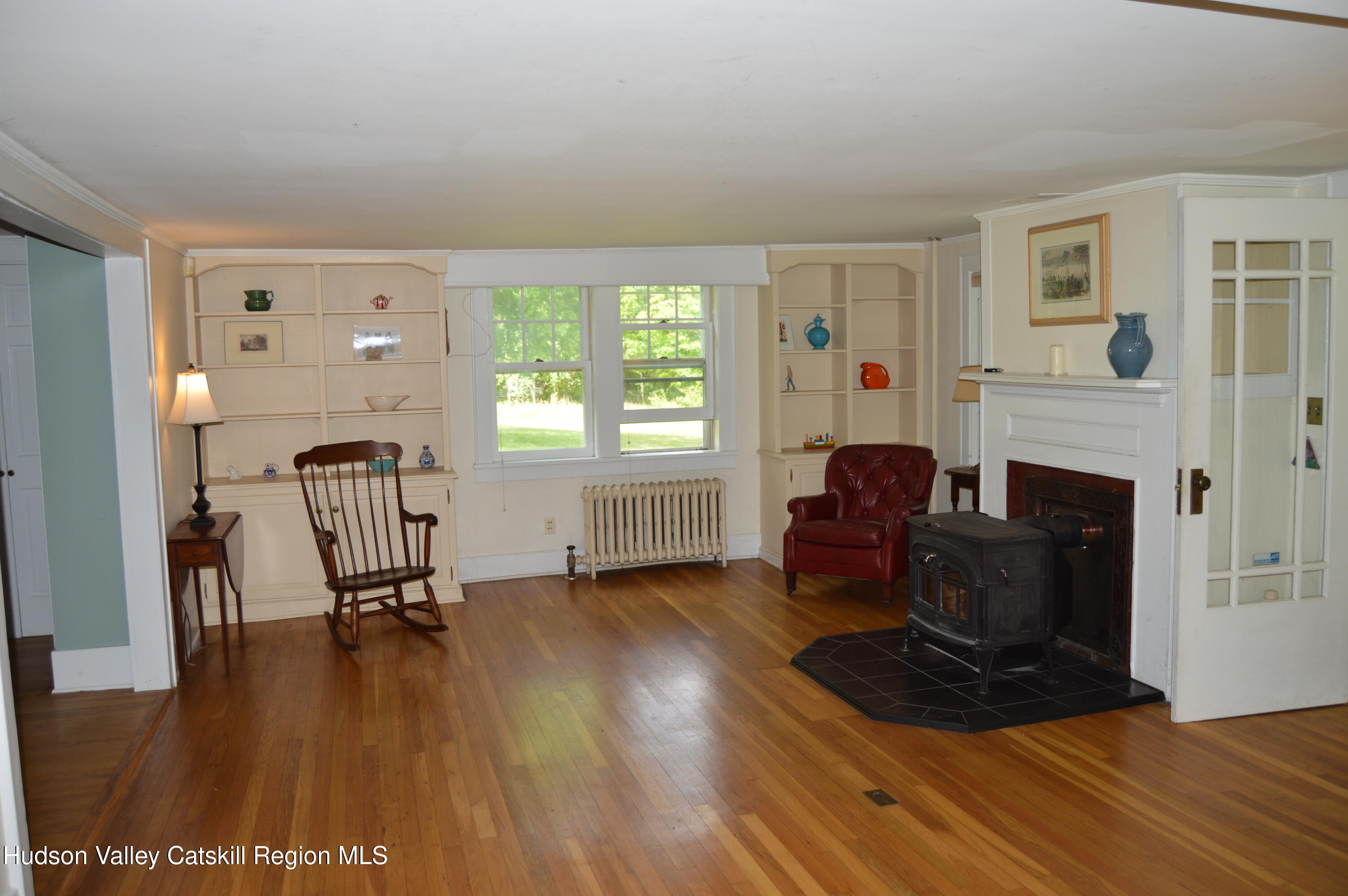 3493 County Road 7 Craryville, NY 12521 - Photo 8 of 36 a living room with furniture and a fireplace