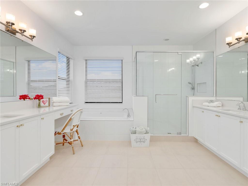 20581 Fair Oak Lane Estero, FL 33928 - Photo 13 of 46 Owner Spa-Inspired Bathroom with Dual Vanities, Step-in Shower & Separate Soaking Tub