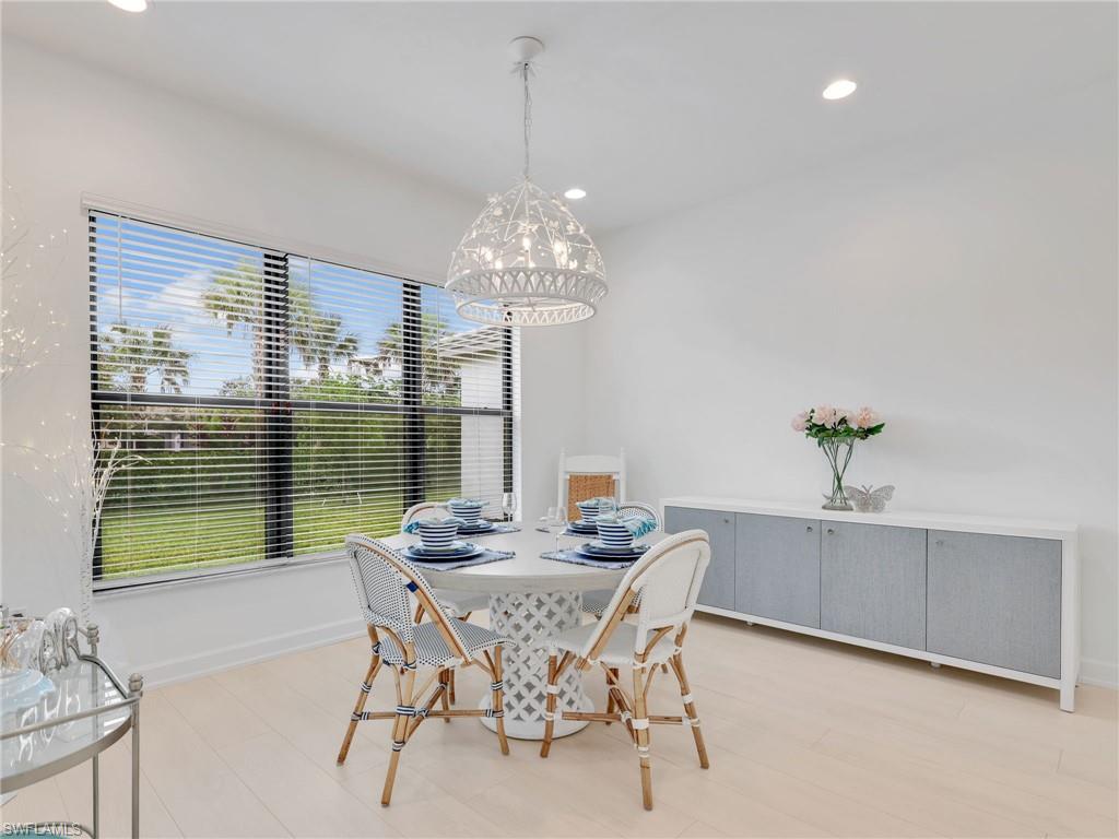 20581 Fair Oak Lane Estero, FL 33928 - Photo 9 of 46 Spacious Dining Area with Custom Lighting