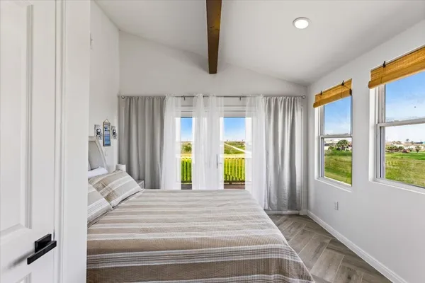 a view of an entryway with wooden floor and windows