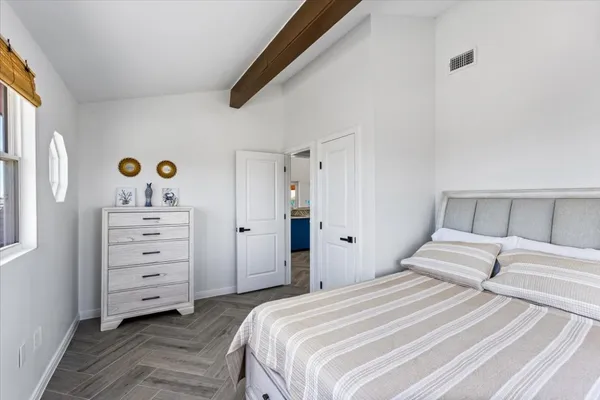 a bedroom with a bed and a cabinets