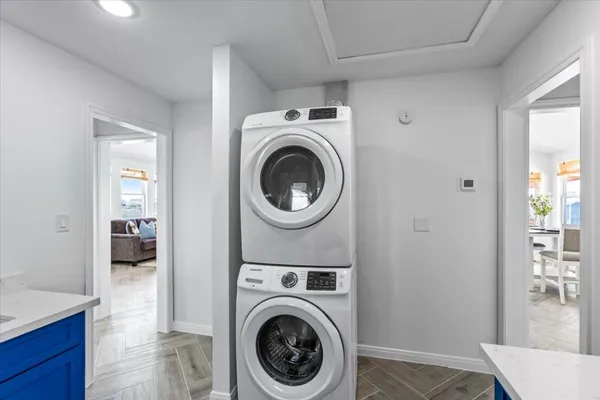 a view of a hallway with washer and dryer