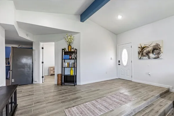 a view of a livingroom with wooden floor