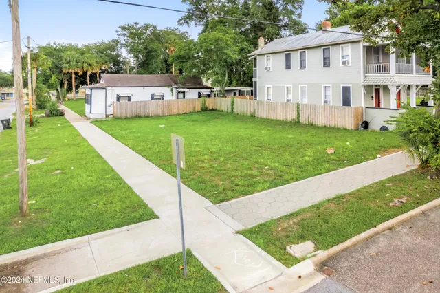 a view of a house with a yard porch and sitting area