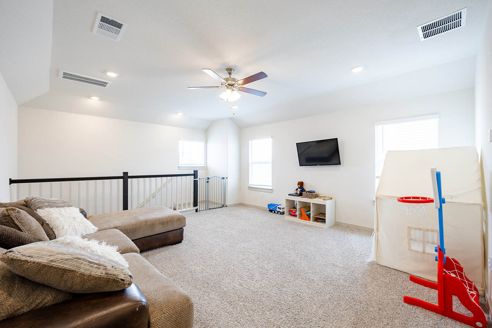 900 Balsora Cove Georgetown, TX 78628 - Photo 20 of 39 A versatile bonus room offering ample space for various activities, naturally illuminated by multiple windows.