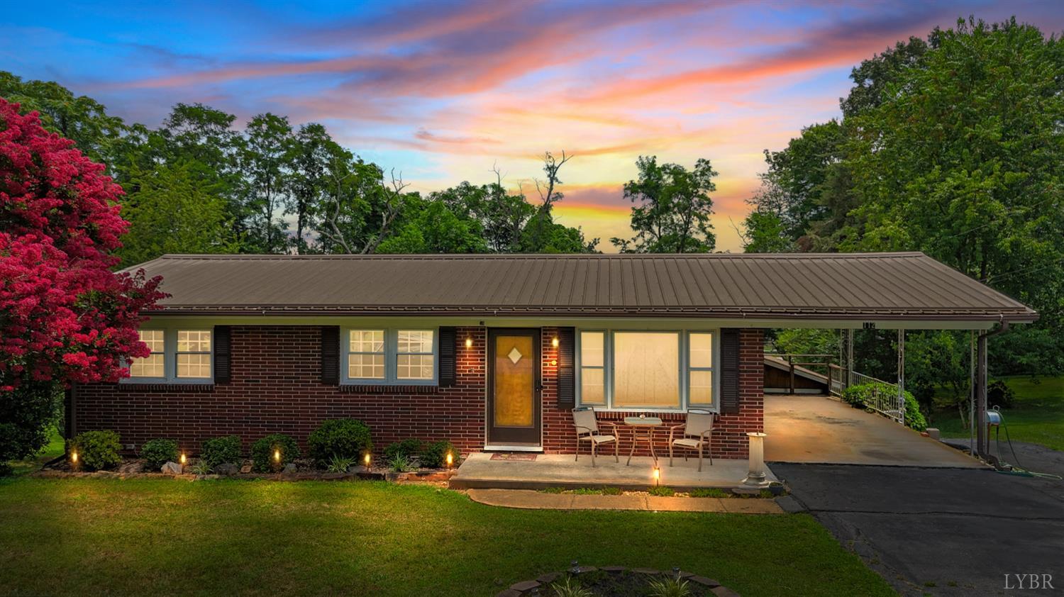 a view of house with yard outdoor seating and green space