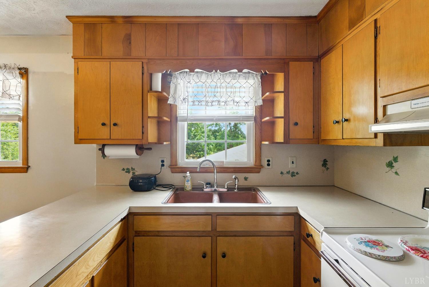112 Hillside Road Hurt, VA 24563 - Photo 11 of 39 a kitchen with a sink and cabinets