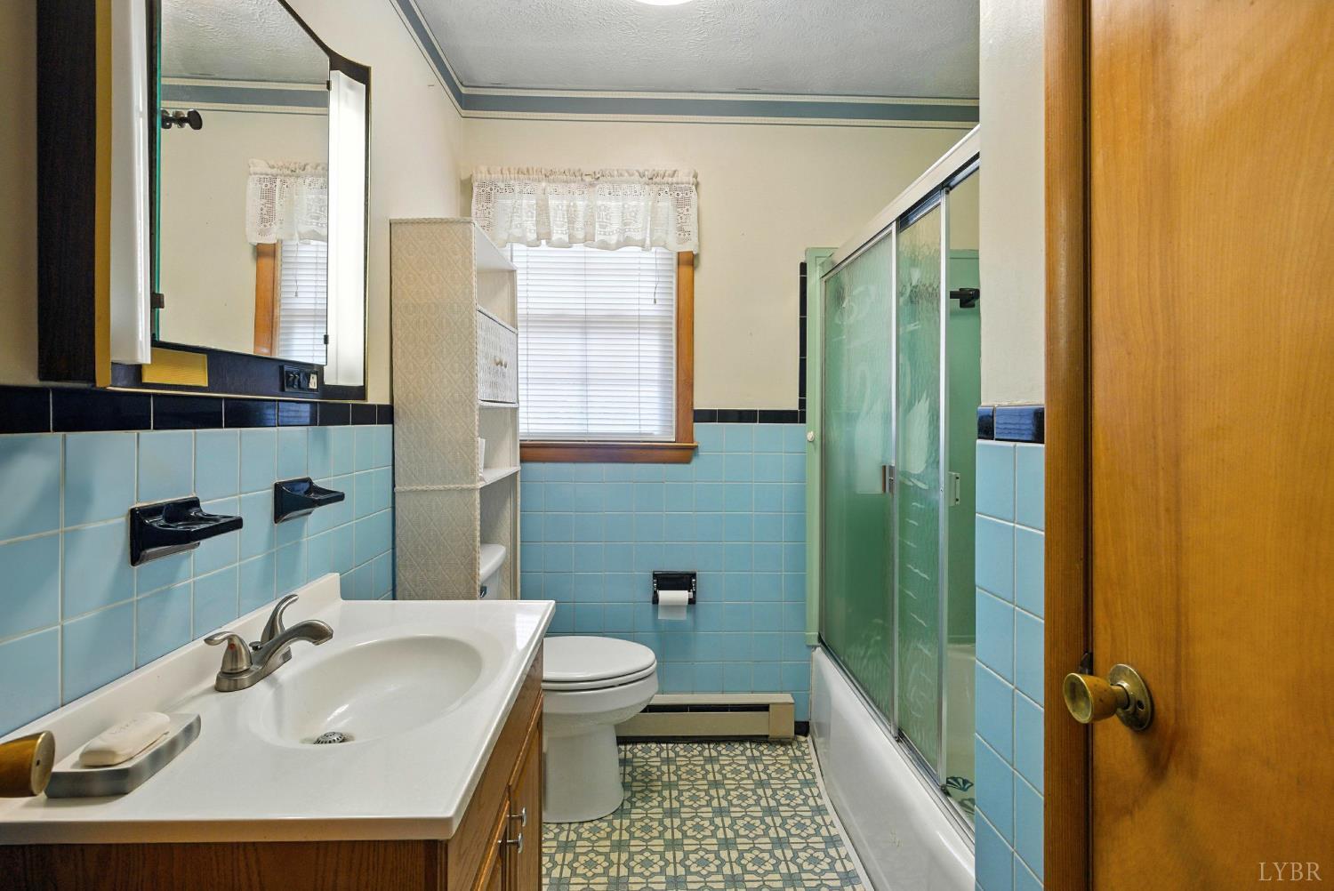 112 Hillside Road Hurt, VA 24563 - Photo 16 of 39 a bathroom with a sink a toilet and shower