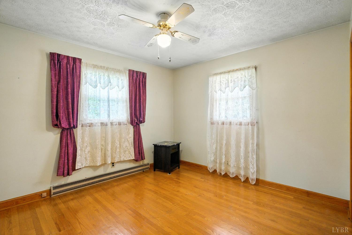 112 Hillside Road Hurt, VA 24563 - Photo 17 of 39 a view of room with a ceiling fan and a window