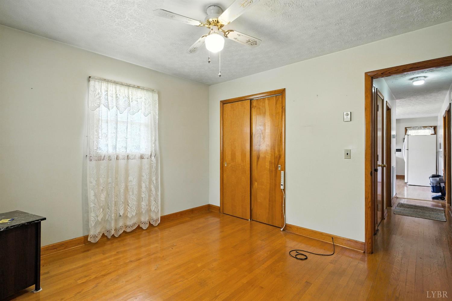 112 Hillside Road Hurt, VA 24563 - Photo 18 of 39 an empty room with closet and a chandelier fan