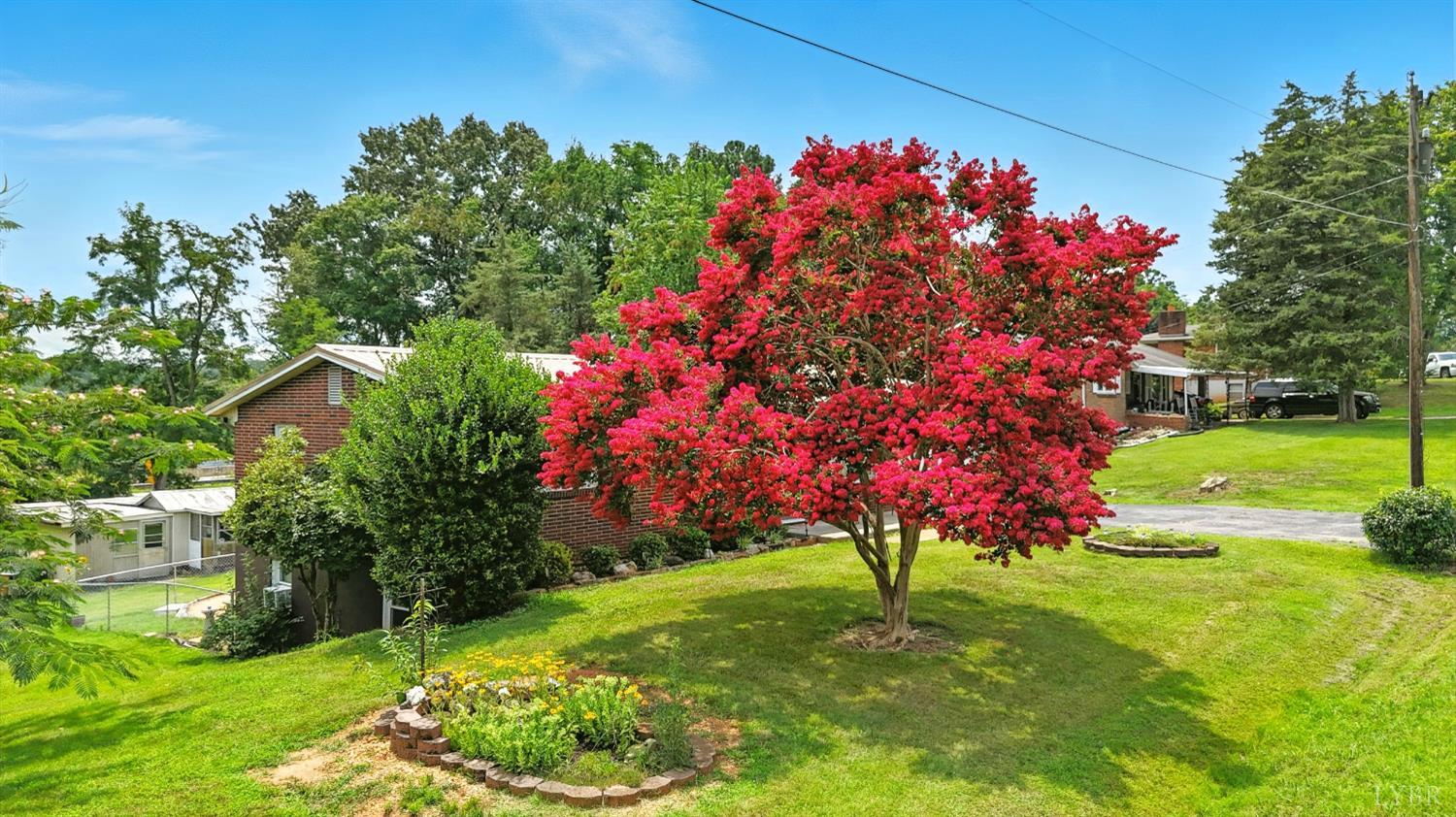 112 Hillside Road Hurt, VA 24563 - Photo 33 of 39 a view of a house with a big yard and potted plants