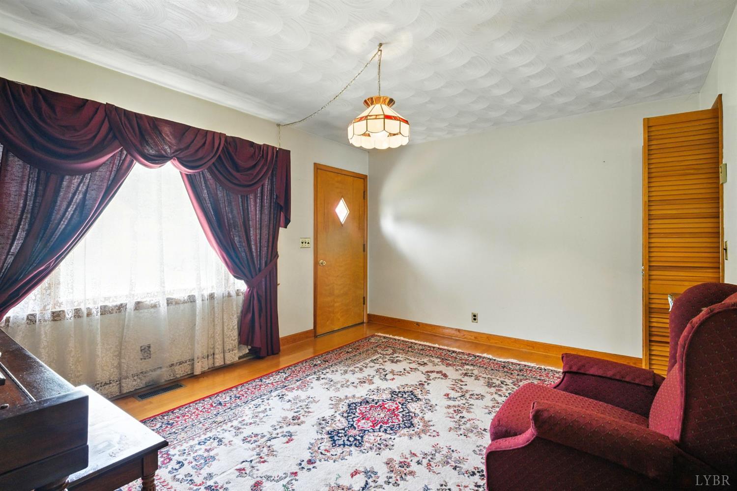 112 Hillside Road Hurt, VA 24563 - Photo 4 of 39 a view of a livingroom with furniture and staircase