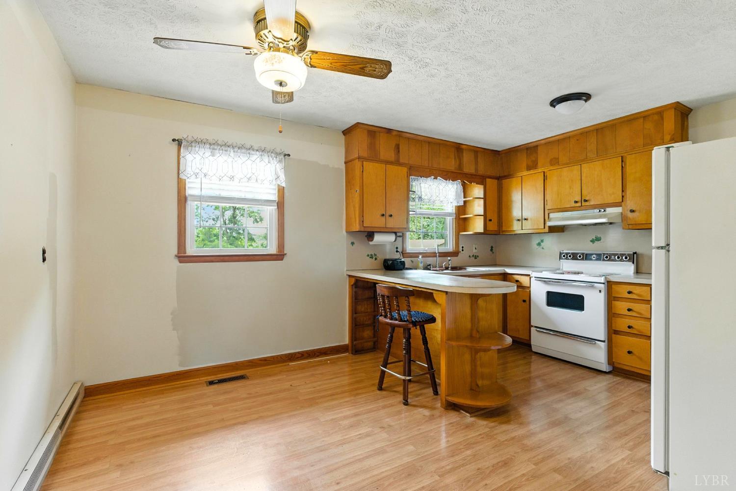 112 Hillside Road Hurt, VA 24563 - Photo 6 of 39 a kitchen with a refrigerator window and a sink