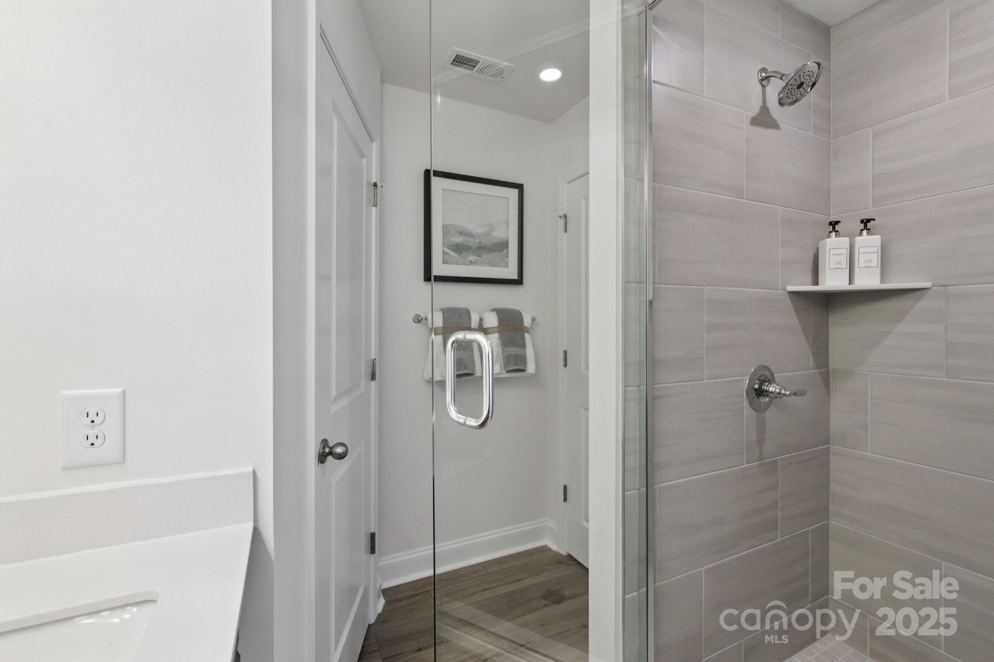 7717 Ethora Way Charlotte, NC 28216 - Photo 12 of 24 a bathroom with a shower
