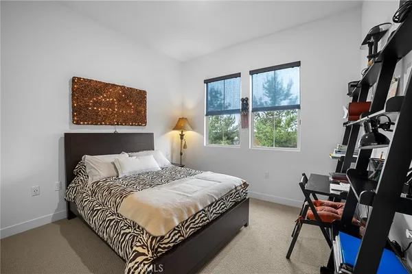 a bedroom with bed and a window